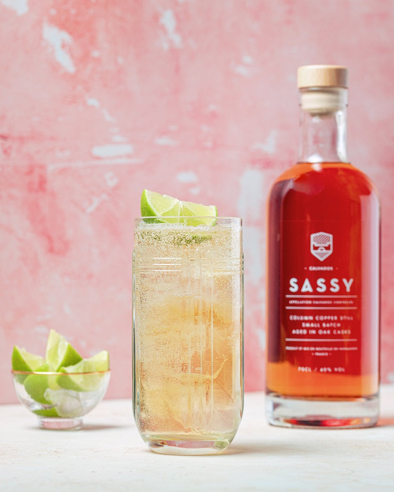 Maison Sassy calvados next to clear and sparkling calvados cocktail